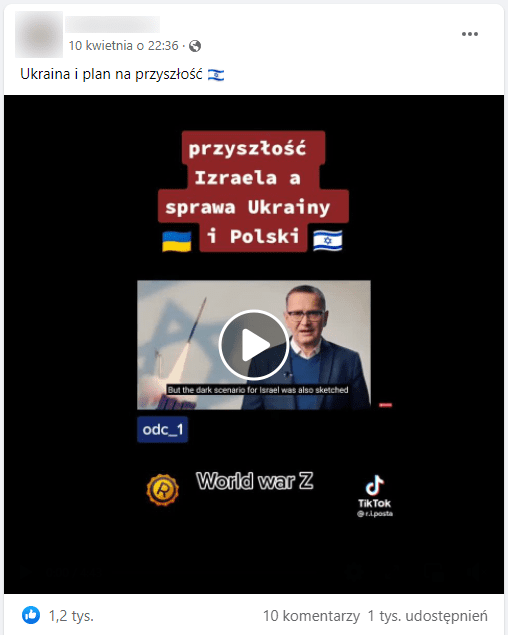 Zrzut ekranu omawianego posta na Facebooku. W Kadrze filmu widzimy mężczyznę w marynarce i niebieskim swetrze. Występuje na tle flagi izraelskiej.
