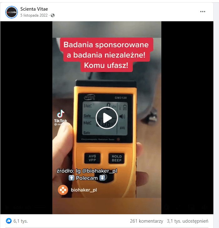 Kadr z filmu na Facebooku na którym widać żółte urządzenie mające być miernikiem fal elektromagnetycznych.