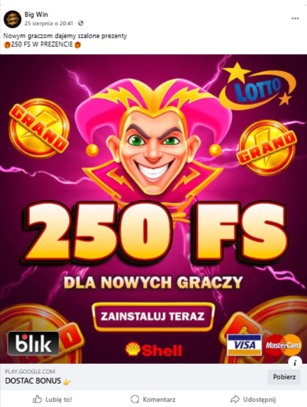 Wpis na Facebooku reklamujący grę-kasyno. Na grafice widać postać uśmiechniętego błazna, wokół którego unoszą się monety z napisem „grand”, a w rogach grafiki są logotypy znanych marek